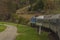 Blue diesel locomotive and blue passenger coach near Jihlava town 29 04 2022
