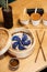 Blue Dim Sum chinese cuisine in bamboo steamer and pot. Top view fresh dumplings with hot steams on wood plate with