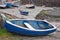 Blue dinghy laid up in a UK harbor