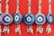 Blue discs of symbolic evil eye protection fobs.