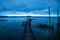 Blue dock along the lake shore before sunset, El Remate, Peten, Guatemala