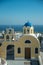 Blue dome church in Fira village, Santorini island, Greece