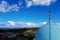 A blue dome with a golden cross of the Valaam Monastery of the Savior Transfiguration on a clear sky background close-up