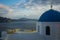 Blue dome of white church and clouds, Oia, Santorini, Greece
