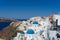 Blue domed church along caldera edge in Oia, Santorini