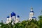 Blue domes of an ancient Orthodox monastery on a sunny summer day. Vladimir region, Russia.