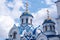 Blue domes of the Church of the Holy Equal-to-the-Apostles Grand Duke Vladimir in summer in