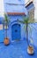 Blue door in a blue wall in Chefchaouen, Morocco