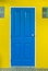 blue door is locked with yellow wall