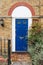Blue door in typical british style in London, UK