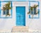 blue door on a whitewashed Greek house.