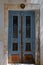 Blue door with wrought iron