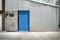 Blue door and zinc wall of warehouse