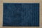 blue doormat isolated on wood texture background