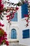 Blue doors, window and white wall of building in Sidi Bou Said