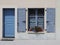 Blue doorway and shuttered window