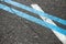 Blue double dividing line on asphalt road
