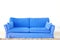 Blue double sofa on a blank wall