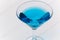 Blue drink in transparent coctail glass close-up