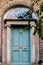 Blue Dublin door over brick wall