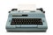 Blue electric typewriter on white