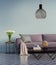 Blue elegant purple sofa with a side table and flowers