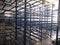Blue empty racks in warehouse in production area
