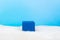 blue empty stand on blue shadow background and white fluffy bottom. Blank unbranded shopfront.