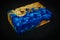 blue epoxy resin with nature burl maple wood cube on black background
