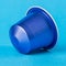 Blue espresso cup on a blue background. Modern conceptual art.