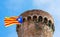 Blue Estelada flag flying waving beautifully in the wind at ancient castle tower. Estelada blava is unofficial flag, symbol of