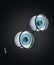 The blue eyeball of the human eye and black round glasses floating in a dark background.