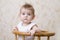 Blue Eyed Baby On High Chair