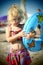 Blue eyed blond little girl on the beach in the summertime