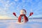 Blue eyed snowman. Sunrise enlightens the sky and clouds by warm colors. Reflecting on the snow. Mountains landscape. Joyful cold