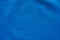 Blue fabric sport clothing football jersey with air mesh texture background