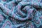 Blue fabric texture background or wavy textile sample with pattern