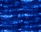 Blue fabric texture, batik pattern, shibori design, seamless pattern. Indigo blue tones.