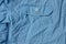 Blue fabric texture from crumpled shirt with pocket