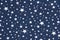 Blue fabric texture with white small stars a pattern
