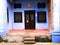 Blue facade of house in street at George Town, Malaysia