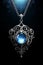 Blue fantasy necklace pendant - silver chain - black background - blue glow - blue opal