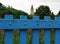 Blue fence with church