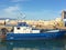 BLUE FISHING BOAT IN HARBOUR