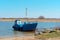 Blue fishing boat moored, fishing boat on the shore