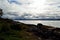 Blue fjord, sunhine and thick clouds