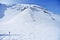 Blue flag on a mountain in winter