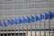 Blue flags of Europe in front of Berlaymont, seat of the European Commission, Brussels, Belgium