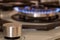 The blue flame of the gas burner. Kitchen stove