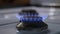 Blue Flame on a kitchen Gas Stove, turning gas up creating a bigger flame on the cooker